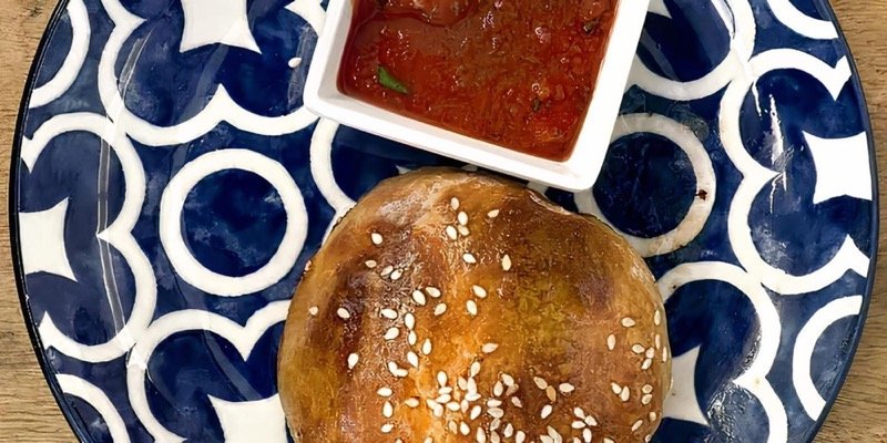Flaky samsa pastries with sesame seeds