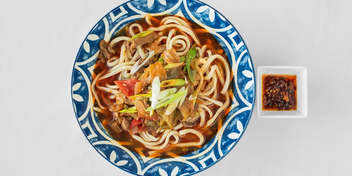 Uyghur lagman noodle soup with beef and vegetables